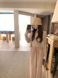 Knitting Season_Soft Sky Silk Sling With Two Sets Of White Knitted Cardigan Outside Sunscreen