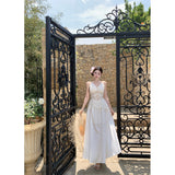 2025 High-End Design White Temperament Early Spring French Holiday Hanging Neck Hollow Embroidery Tying Dress